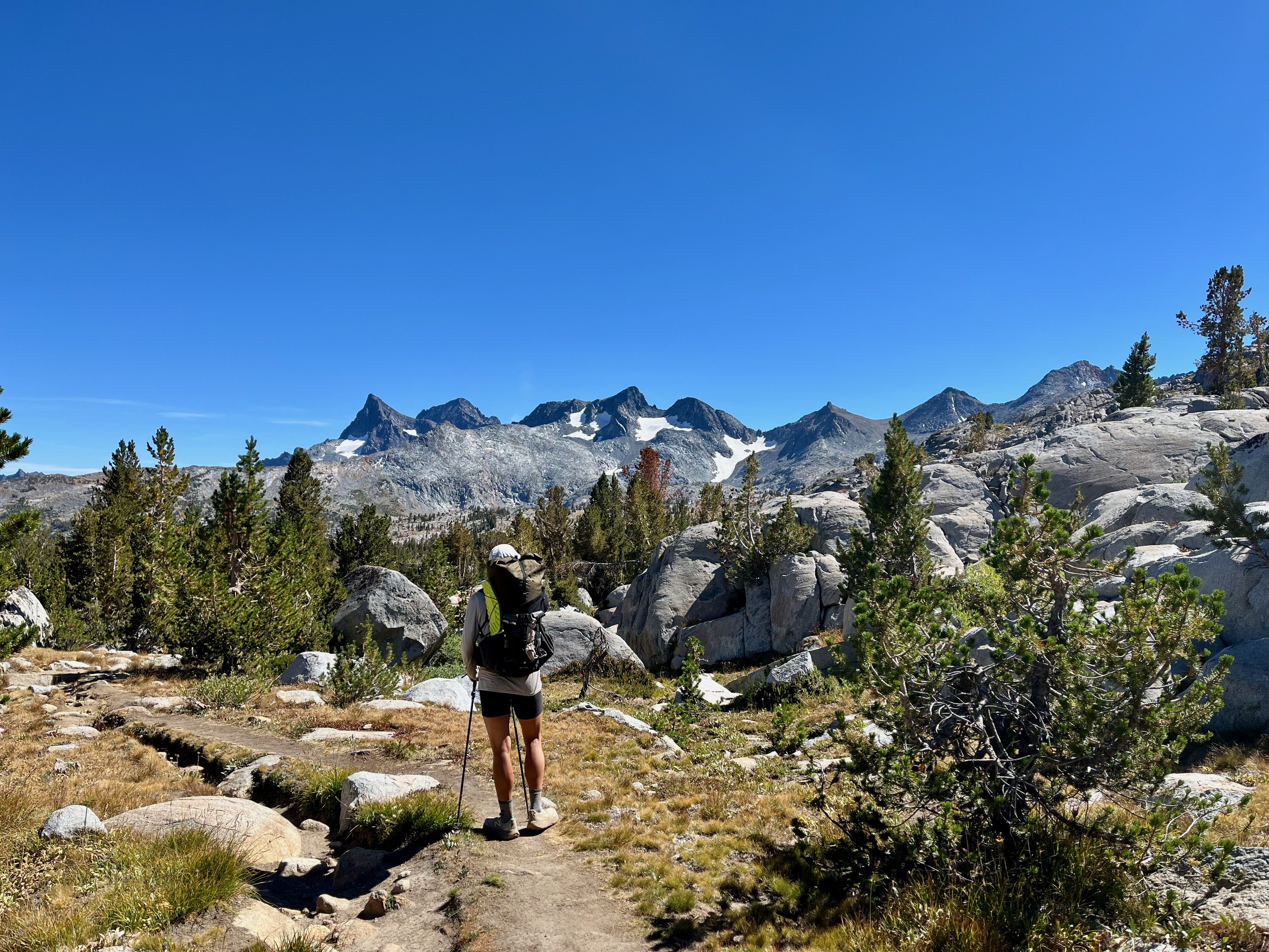 Hiker with backpacking looking back on the Ritter range